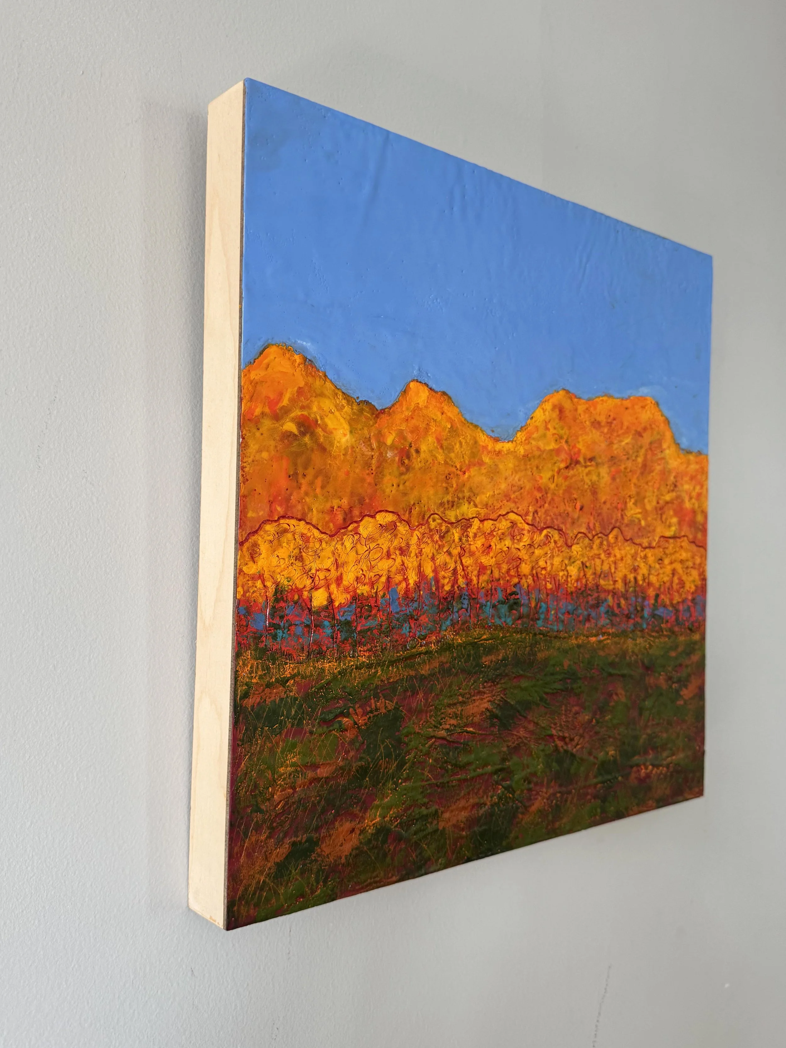 encaustic painting of peak foliage season in Vermont with brightly